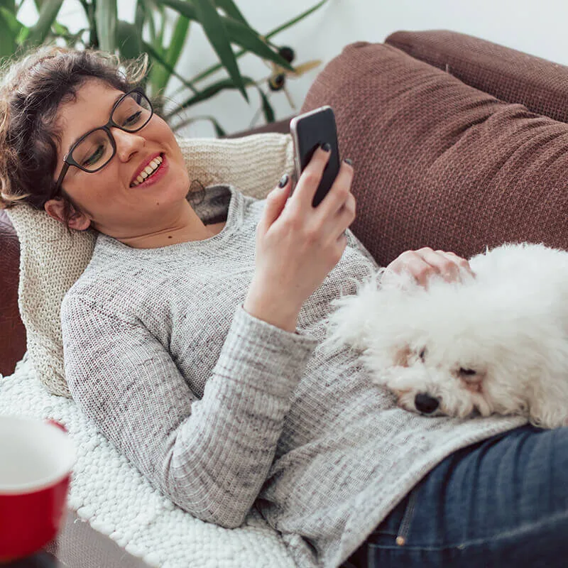 woman with phone on couch